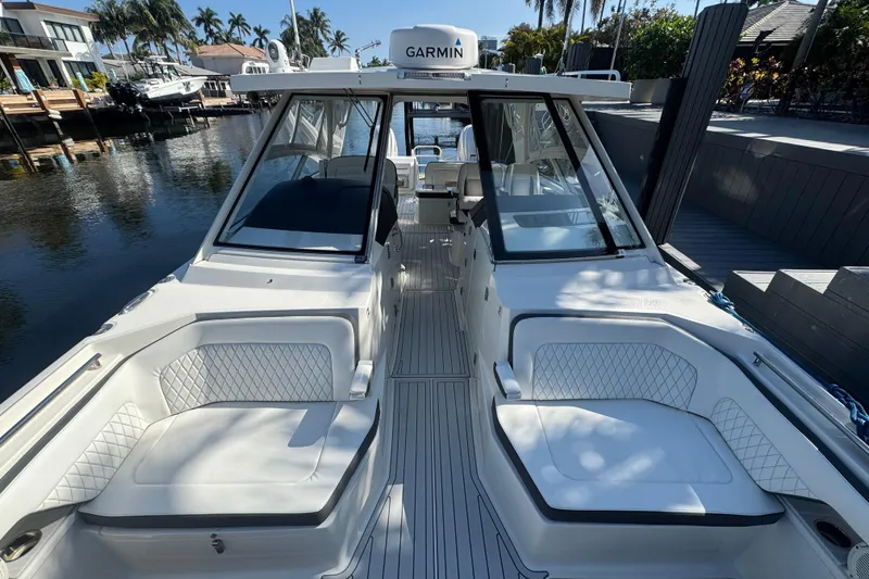 Slide: The Image of 2021 World Cat 400 DC-X boat with luxurious seating and Garmin navigation system. - 2