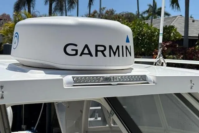 Slide: The Image of Garmin radar on 2021 World Cat 400 DC-X boat, with tropical background. - 26
