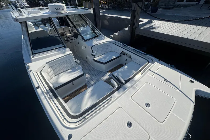 Slide: The Image of 2021 World Cat 400 DC-X boat with spacious seating and modern design. - 4