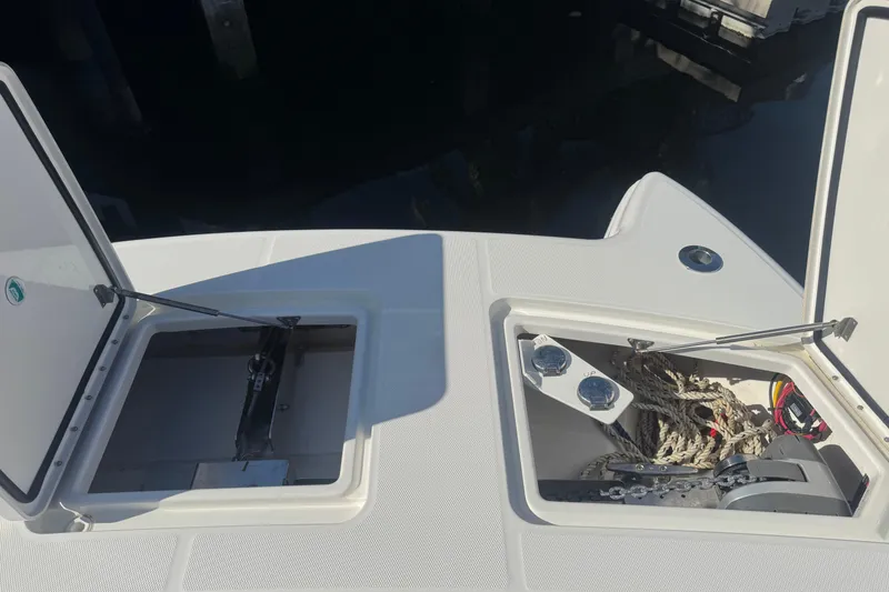 Slide: The Image of Open storage compartments on 2021 World Cat 400 DC-X boat deck. - 7