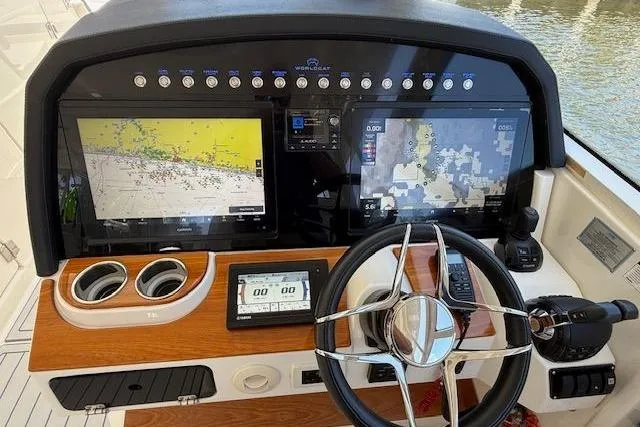 Slide: The Image of Helm of 2021 World Cat 400 DC-X with navigation screens and controls. - 9
