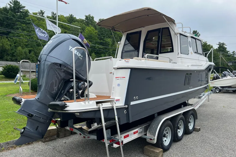 Slide: The Image of 2025 Ranger Tugs R-25 boat on trailer with Yamaha outboard motor. - 4