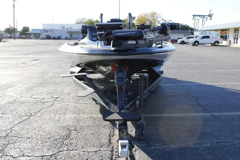 Slide: The Image of 2023 Skeeter ZXR21 boat on trailer in parking lot, front view. - 13