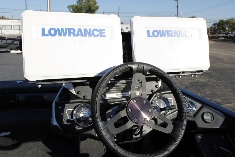 Slide: The Image of 2023 Skeeter ZXR21 boat dashboard with dual Lowrance HDS displays and steering wheel. - 25