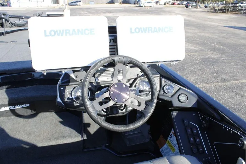 Slide: The Image of 2023 Skeeter ZXR21 boat dashboard with Lowrance displays and steering wheel. - 28