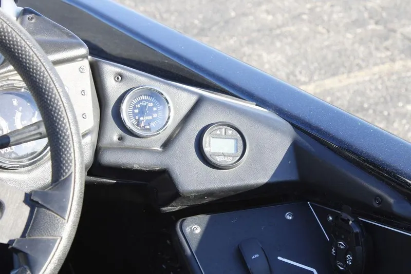 Slide: The Image of 2023 Skeeter ZXR21 dashboard with gauges and controls. - 29