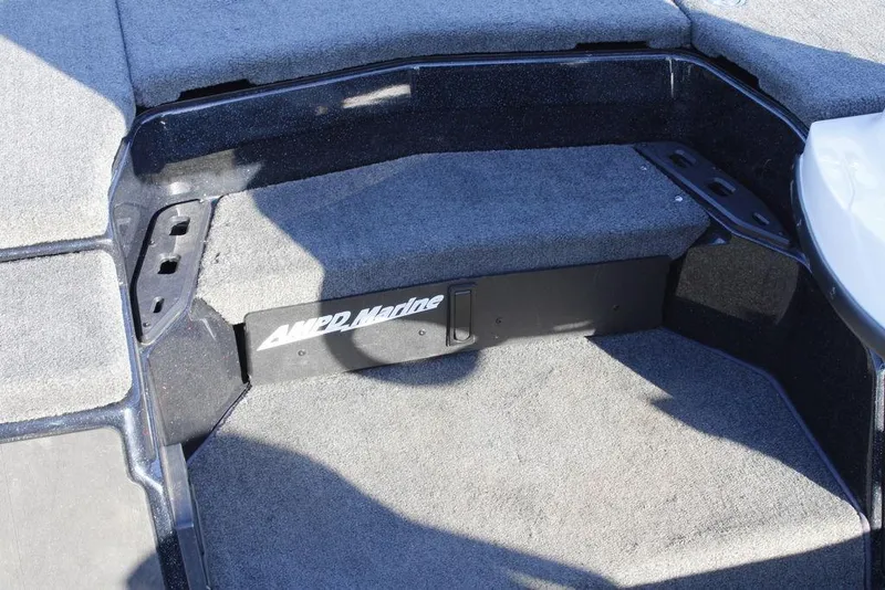 Slide: The Image of 2023 Skeeter ZXR21 boat interior with carpeted flooring and storage compartment. - 33