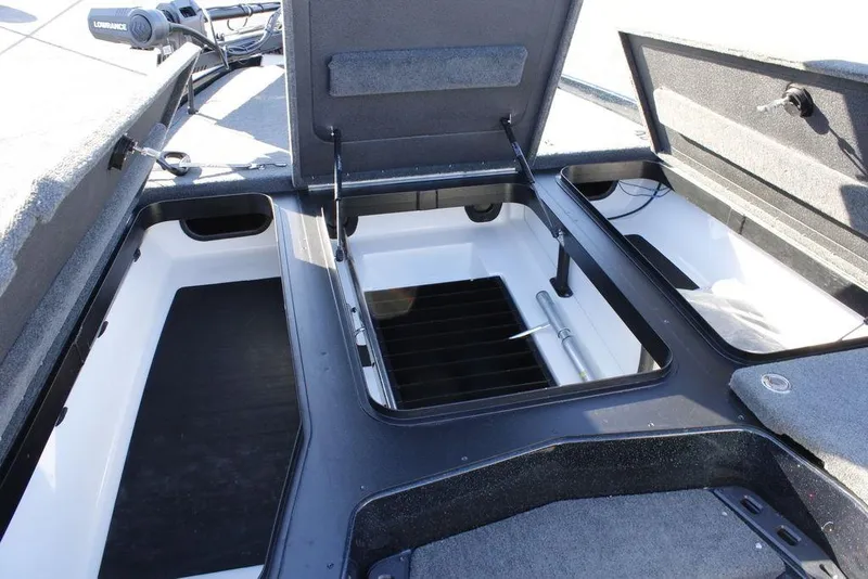 Slide: The Image of 2023 Skeeter ZXR21 boat storage compartments with open lids, showcasing interior space. - 6