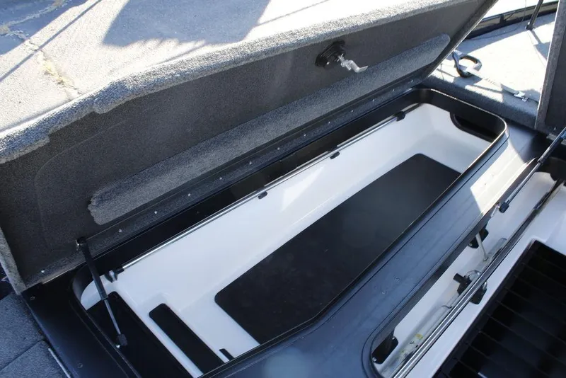 Slide: The Image of Open storage compartment in 2023 Skeeter ZXR21 boat, showcasing spacious interior design. - 8