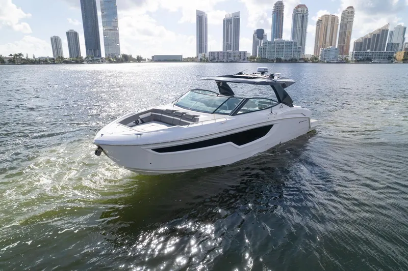 The Image of 2022 New Cruiser Yachts GLS 38 on water, sleek design, city skyline background. - 0