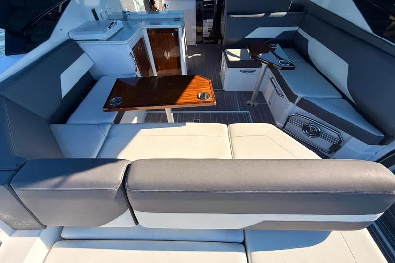 Slide: The Image of 2022 New Cruiser Yachts GLS 38, luxury seating area with ocean view and city skyline. - 55