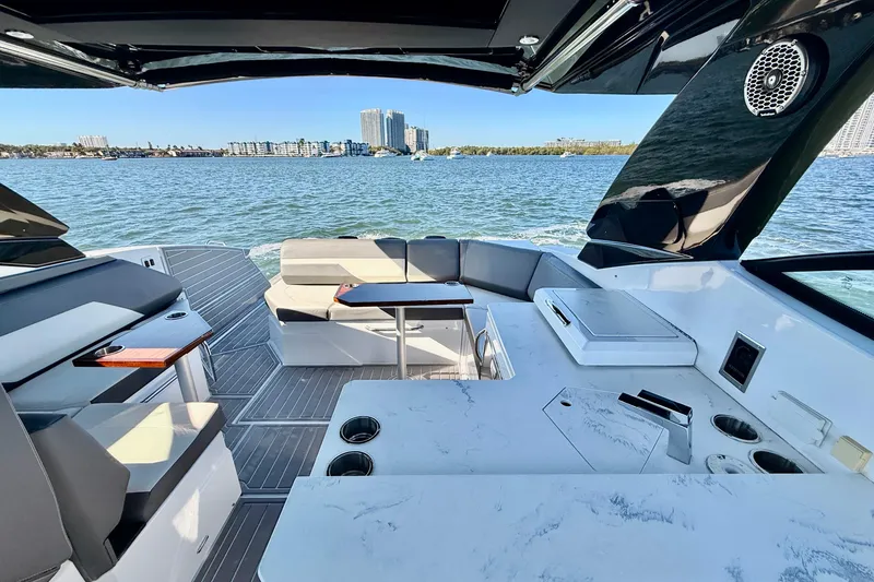 Slide: The Image of Luxurious 2022 New Cruiser Yachts GLS 38 interior with seating and table on the water. - 62