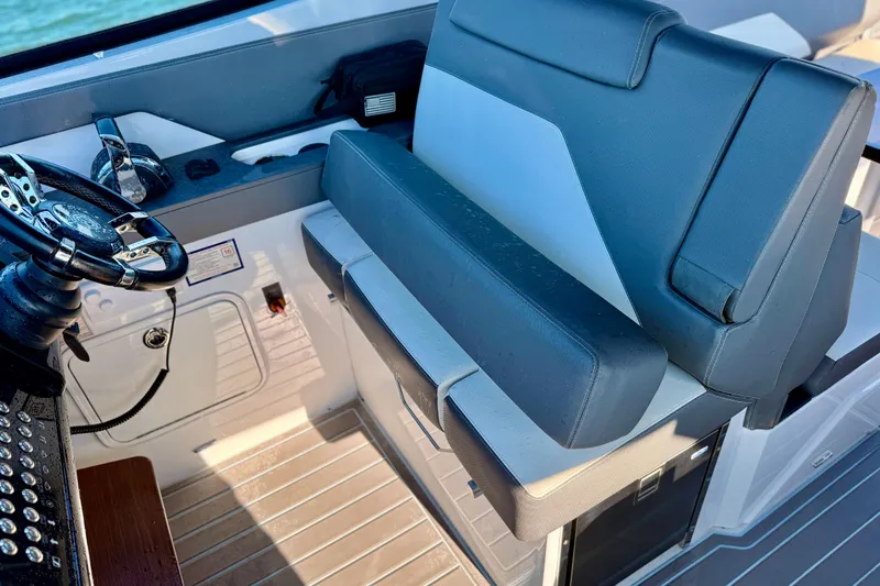 Slide: The Image of Captain's seat and helm of 2022 New Cruiser Yachts GLS 38, featuring modern controls. - 24