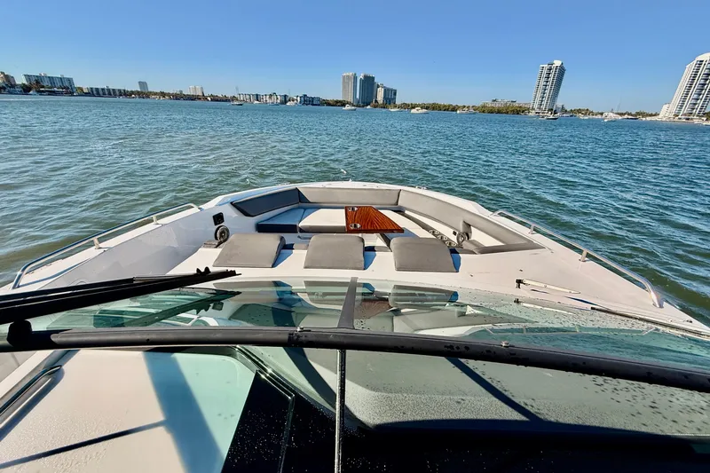 Slide: The Image of 2022 New Cruiser Yachts GLS 38 on water, city skyline in background. - 26