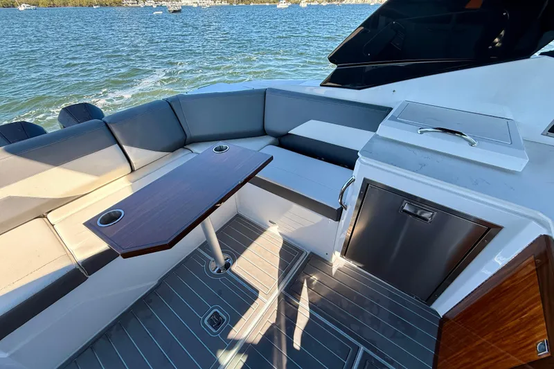 Slide: The Image of Luxurious 2022 New Cruiser Yachts GLS 38 interior with seating and table on the water. - 54