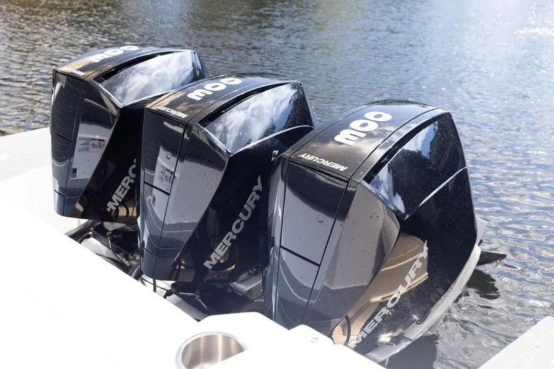 Slide: The Image of Triple Mercury outboard engines on 2022 New Cruiser Yachts GLS 38, docked on water. - 9