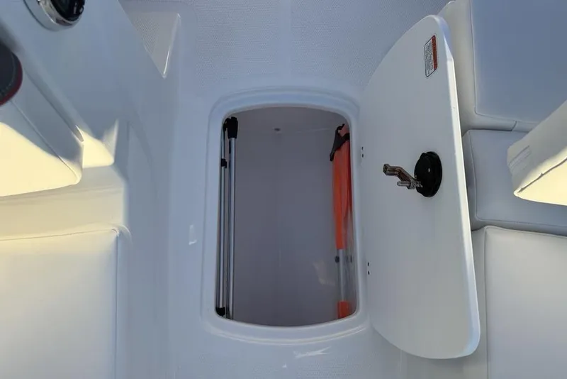Slide: The Image of 2026 Tahoe T16 boat storage compartment with open hatch and visible interior. - 11
