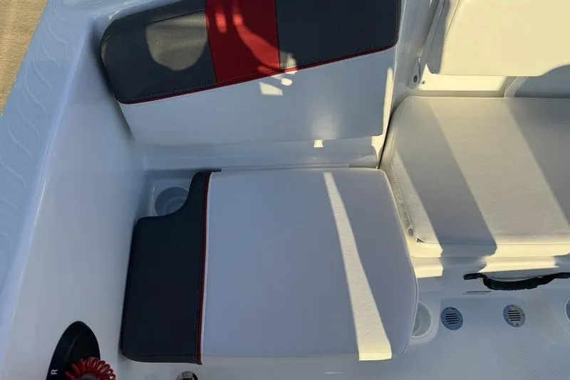 Slide: The Image of 2026 Tahoe T16 boat interior with white and gray seating, featuring red accents. - 14