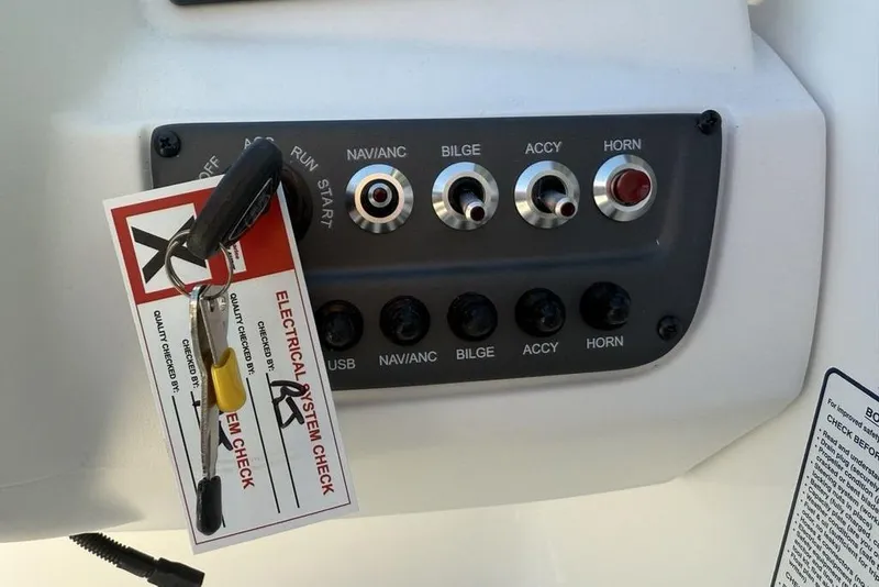 Slide: The Image of Control panel of 2026 Tahoe T16 boat with electrical system check tag. - 16