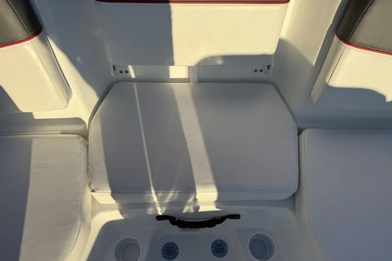 Slide: The Image of Interior seating of 2026 Tahoe T16 boat with white cushions and cup holders. - 20