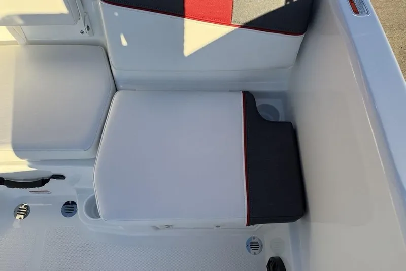 Slide: The Image of 2026 Tahoe T16 boat interior seating with white and red accents. - 21