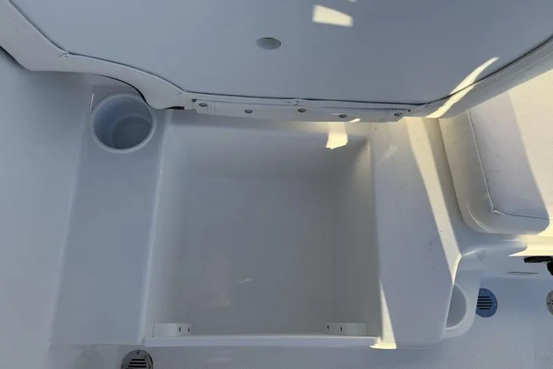 Slide: The Image of Interior view of 2026 Tahoe T16 boat storage compartment with cup holder. - 24