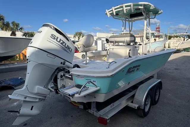 Slide: The Image of 2024 Carolina Skiff 24 Ultra Elite boat with Suzuki outboard motor on trailer. - 3