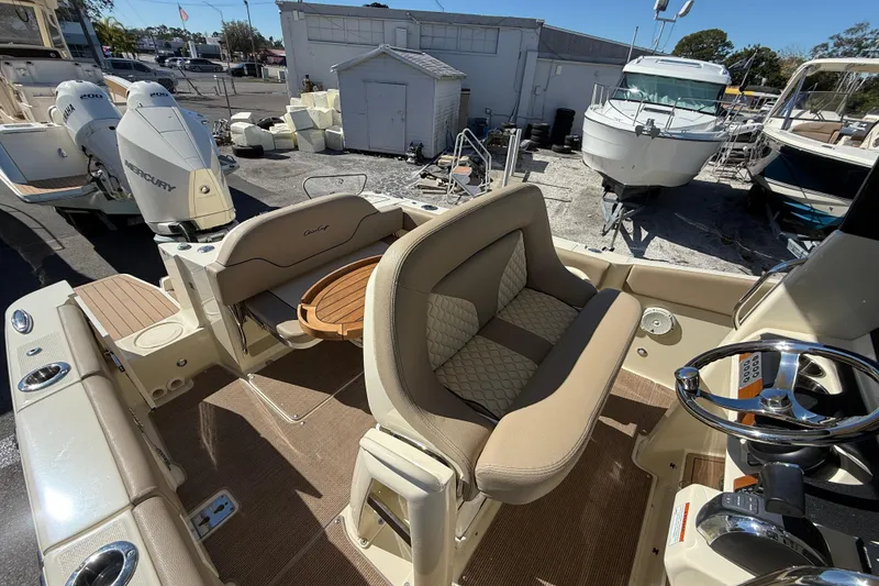 Slide: The Image of 2023 Chris-Craft Catalina 24 boat interior with seating and steering wheel. - 10