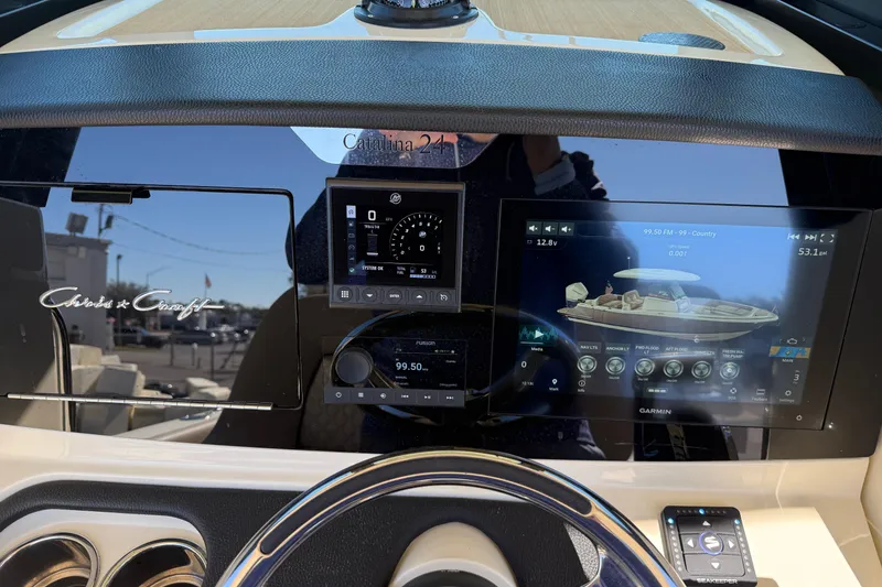 Slide: The Image of Dashboard of 2023 Chris-Craft Catalina 24 with advanced navigation displays. - 12
