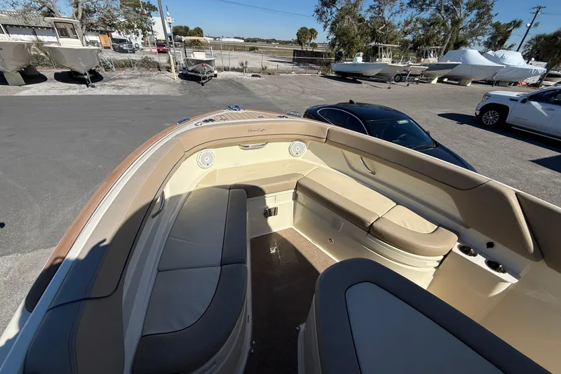 Slide: The Image of 2023 Chris-Craft Catalina 24 boat interior with beige seating and cup holders. - 15