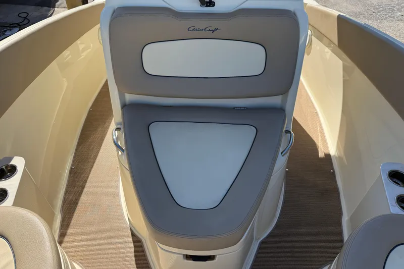 Slide: The Image of 2023 Chris-Craft Catalina 24 boat interior with cushioned seating and cup holders. - 17