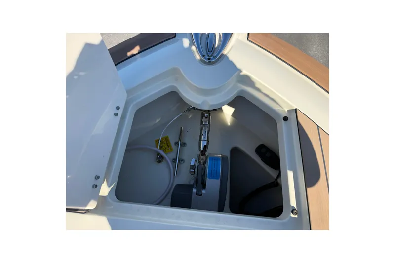 Slide: The Image of 2023 Chris-Craft Catalina 24 anchor locker with chain and storage compartment. - 20