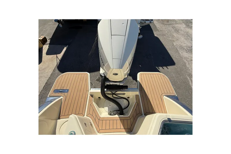 Slide: The Image of 2023 Chris-Craft Catalina 24 boat with teak deck and outboard motor. - 5