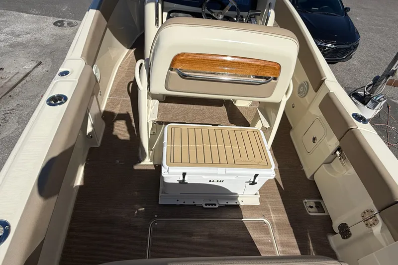 Slide: The Image of 2023 Chris-Craft Catalina 24 boat interior with seating and cooler. - 7