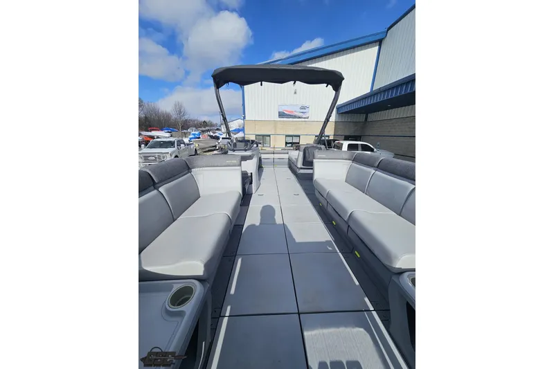 Slide: The Image of 2023 Sea-Doo Switch Cruise 21 pontoon boat with spacious seating and canopy. - 100