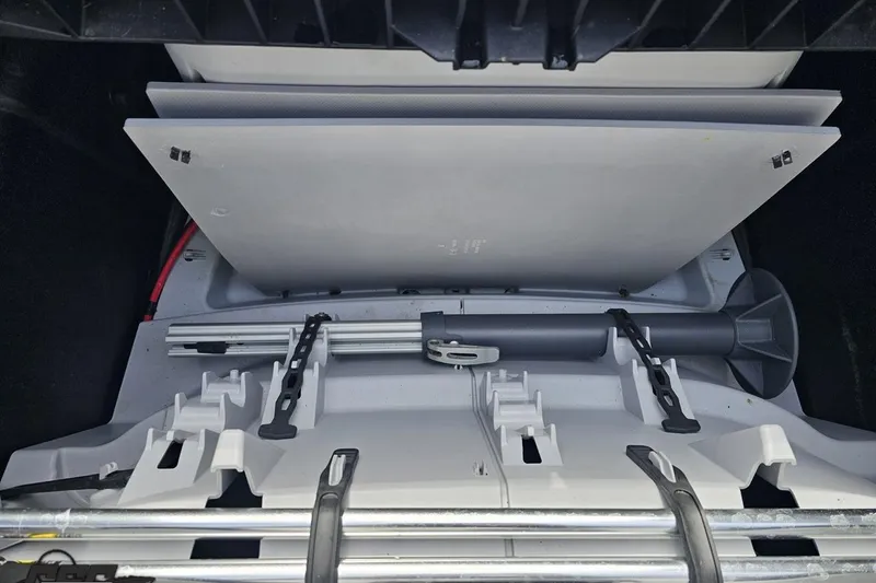 Slide: The Image of 2023 Sea-Doo Switch Cruise 21 storage compartment with organized equipment and accessories. - 104