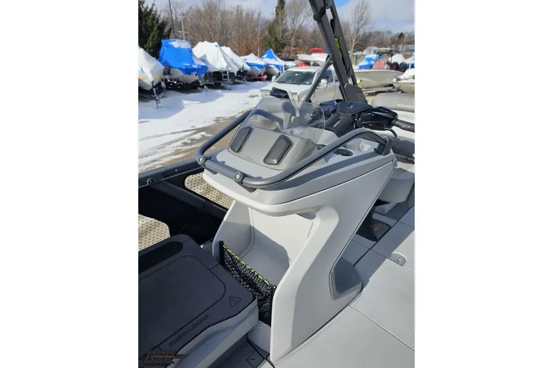 Slide: The Image of 2023 Sea-Doo Switch Cruise 21 dashboard and controls in a snowy outdoor setting. - 105