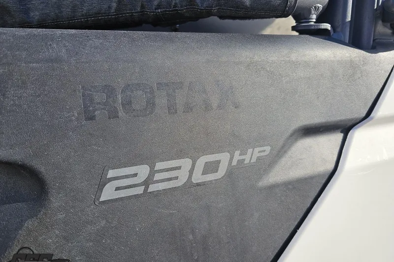 Slide: The Image of Close-up of 2023 Sea-Doo Switch Cruise 21 engine cover, showing "Rotax 230 HP" text. - 11