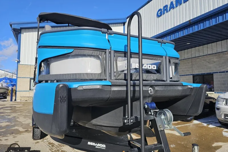 Slide: The Image of 2023 Sea-Doo Switch Cruise 21 boat on trailer outside dealership. - 17
