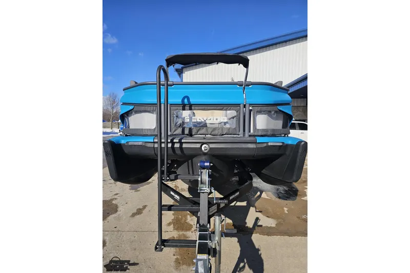 Slide: The Image of 2023 Sea-Doo Switch Cruise 21 on trailer, blue exterior, parked outdoors. - 18
