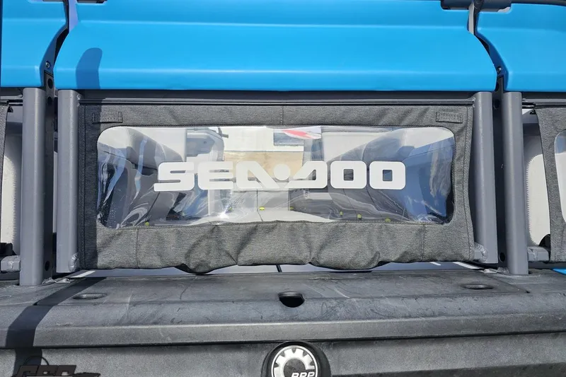 Slide: The Image of 2023 Sea-Doo Switch Cruise 21 rear view with logo and blue canopy. - 20