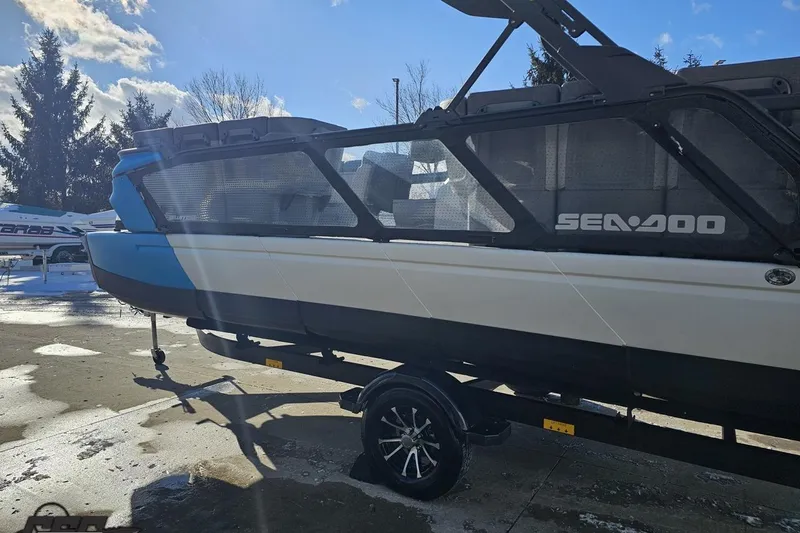 Slide: The Image of 2023 Sea-Doo Switch Cruise 21 boat on trailer, sunny day, outdoor setting. - 31