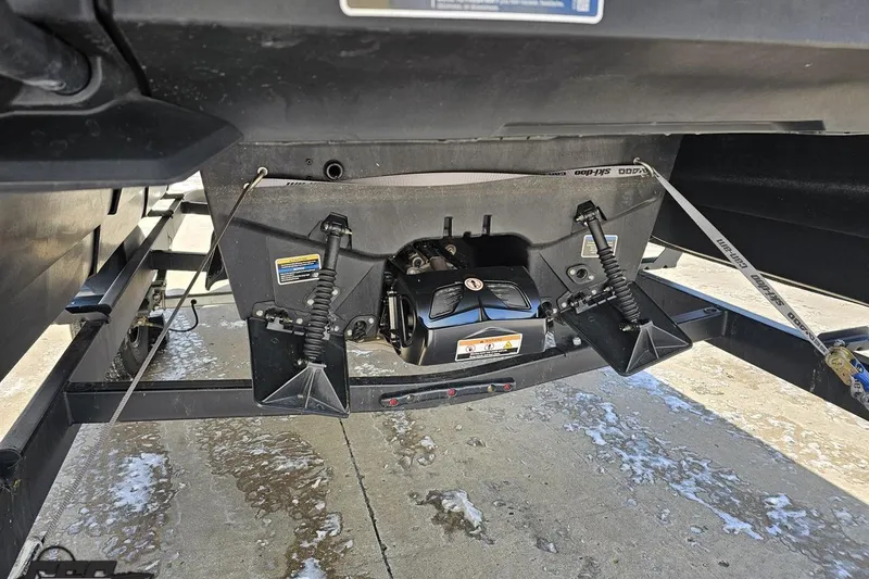Slide: The Image of 2023 Sea-Doo Switch Cruise 21 underside view showing trailer and suspension components. - 36