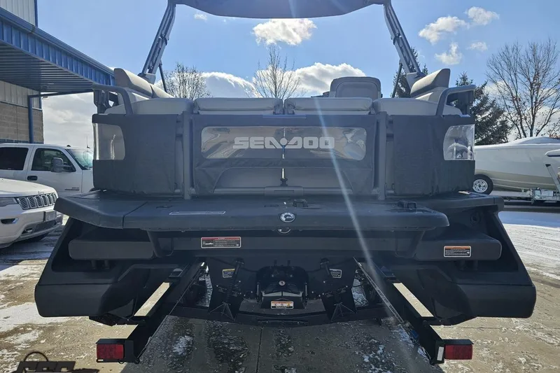 Slide: The Image of 2023 Sea-Doo Switch Cruise 21 pontoon boat rear view in a snowy outdoor setting. - 39