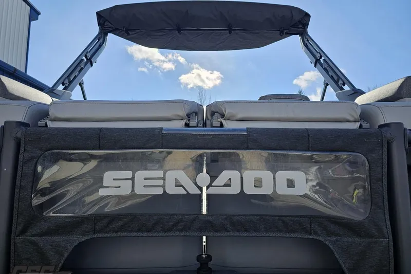 Slide: The Image of 2023 Sea-Doo Switch Cruise 21 boat with canopy under blue sky. - 40