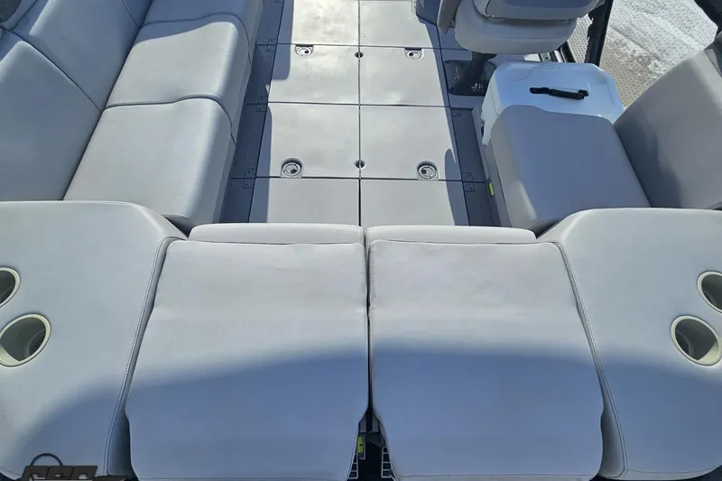 Slide: The Image of 2023 Sea-Doo Switch Cruise 21 interior with spacious seating and cup holders. - 48