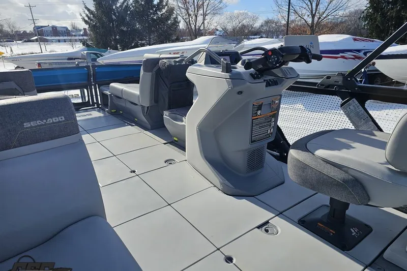 Slide: The Image of 2023 Sea-Doo Switch Cruise 21 interior with modern seating and control console. - 50