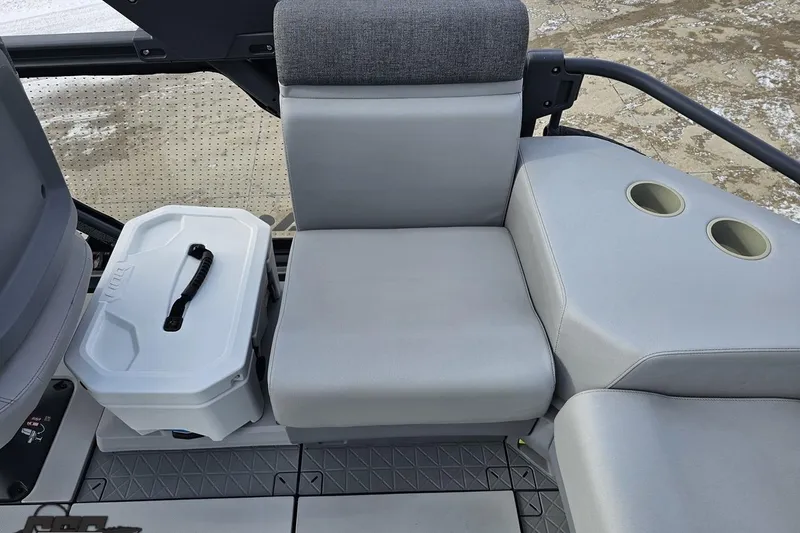 Slide: The Image of 2023 Sea-Doo Switch Cruise 21 interior with seating and cup holders. - 52