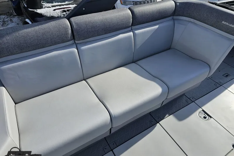 Slide: The Image of 2023 Sea-Doo Switch Cruise 21 boat seating with gray upholstery and modern design. - 58