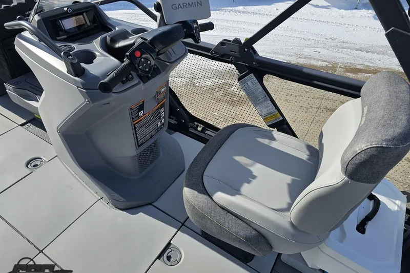 Slide: The Image of 2023 Sea-Doo Switch Cruise 21 cockpit with steering controls and comfortable seating. - 62